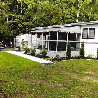 Roulotte stationnaire à vendre - Camping Sainte-Agathe Image# 1