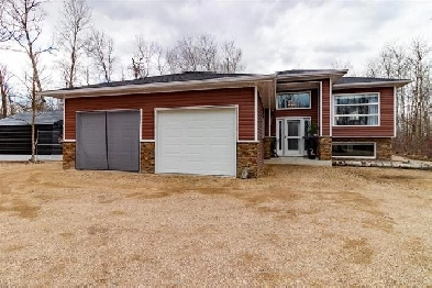 2021 Built Raised Bungalow on 2 acre lot in Ste Anne