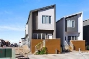 TOWNHOUSE DUPLEX WITH 2 REGULATION SUITES IN HARBOUR LANDING! Image# 1