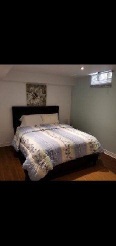 Clean, bright basement apartment for rent with parking Image# 1