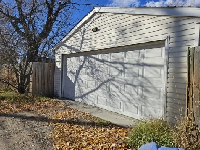 HEATED OVERSIZED DOUBLE GARAGE. Perfect for storage & 2 cars