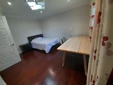 A short-term rental suite with an attached bathroom inside Image# 1