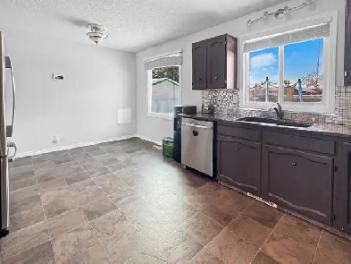 Updated 4-Bedroom Bungalow with Finished Basement & Private Yard Image# 1