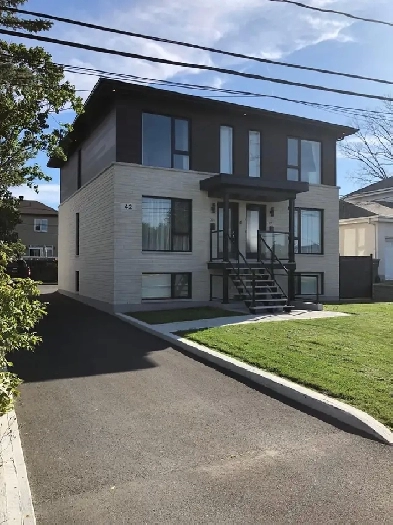 4 1/2 dans un triplex récents de style condo Image# 1