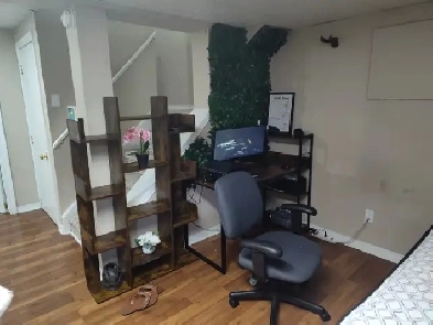 A furnished basement with full kitchen and full bathroom Image# 1