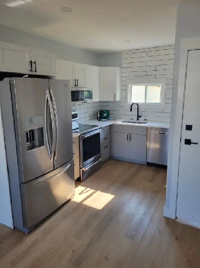 Beautiful, Fully Renovated 2-Bedroom Main Floor Suite W/ Garage Image# 7