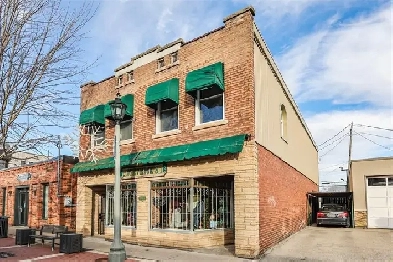MULTI-USE COMMERCIAL STOREFRONT WITH FULL RESIDENCE ABOVE! Image# 1