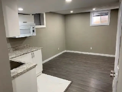 Basement for rent 1 bedroom   living area Image# 5