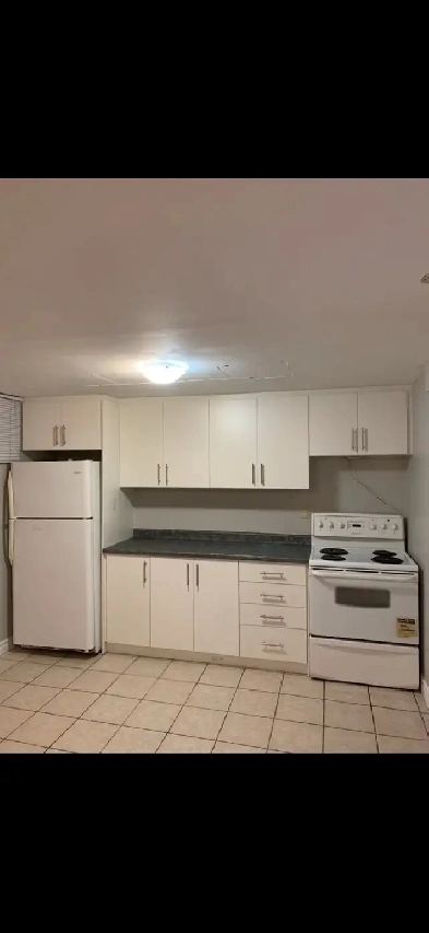 $1,350 all inclusive 2 parking basement apartment Image# 1