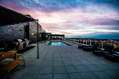 Modern & Furnished Loft-Style Condo - Stunning Views & Amenities Image# 1