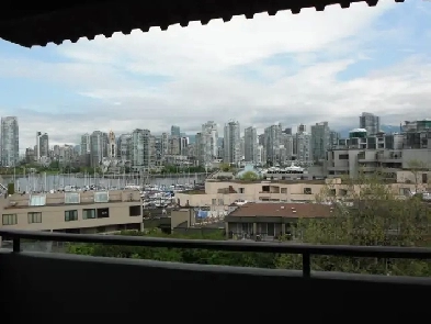 Top Floor 1 Bedroom Apartment Next to Seawall, Water Views Image# 1