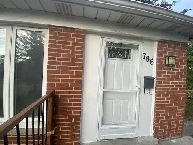 Bright and spacious 2-bedroom upper unit with AC and parking Image# 1