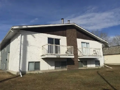 3 Bed Room 1.5 Bath Bi-Level 4 Plex in Highland Green Red Deer Image# 1