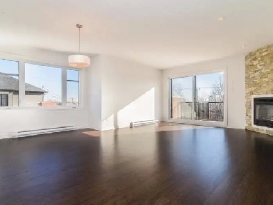 Grand 5 1/2 moderne à Laval – AC, stationnement, piscine incluse Image# 1