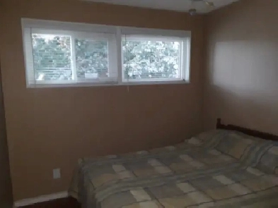Clean Bedroom with Family in Vernon Image# 1