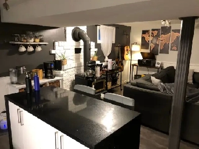 Trendy, Sleek Black Kitchen and Cozy Bedrooms Image# 1