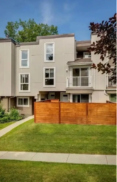 2 bedroom condo backing onto fish creek Image# 1