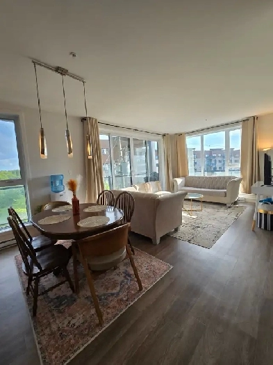 Condo NEUF 5 ½ | 1 400 pi² | Internet   stationnement intérieur Image# 5