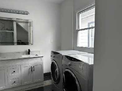 3- bedroom 2 full bathrooms with a bachelor athe basement. Image# 2