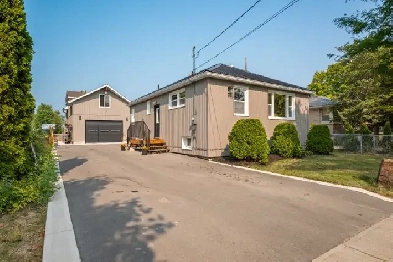 KNG Presents Well-Cared For Home With Monstrous Man Cave Garage Image# 4