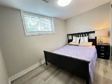 Bright raised basement with two bedrooms for rent in North York. Image# 4