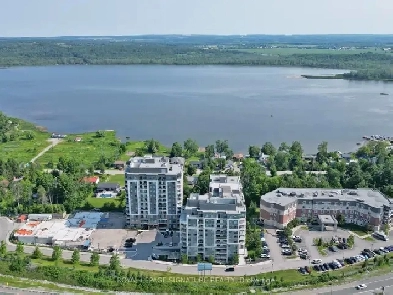 New, bright condo with balcony and lake views! Image# 1