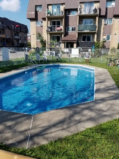 BOISBRIAND GRAND 4 1/2 - Béton Style Condo En Face Le Faubourg Image# 1