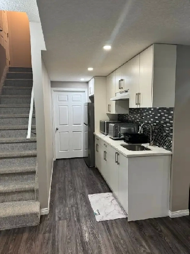 A 2-bedroom walk-out basement that requires a non-smoking family Image# 1