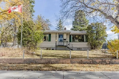 PRICED REDUCED for the Holiday Season! Bungalow on a large lot! Image# 8