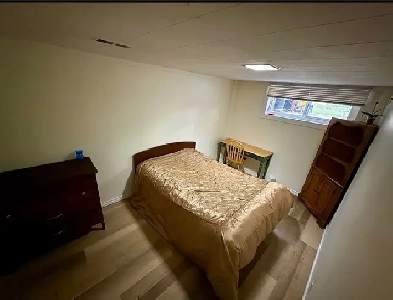 A spacious room fully furnished with a large window for a male Image# 1