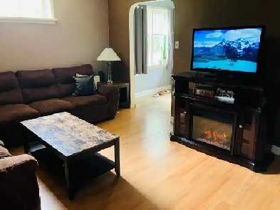 Cute house in great neighbourhood with a park like yard .