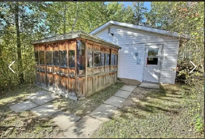 House, several outbuildings & 3 acres along beaver river