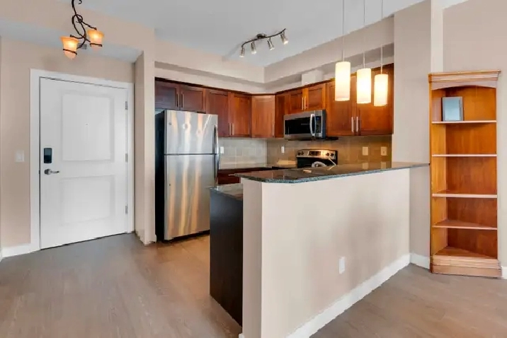 FRESHLY UPDATED TOP FLOOR 2 BED COCHRANE CONDO FOR SALE