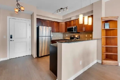 FRESHLY UPDATED TOP FLOOR 2 BED COCHRANE CONDO FOR SALE