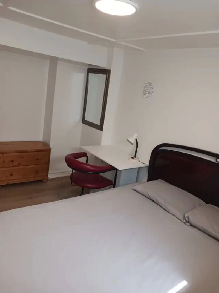 A brand new private day room with a queen-size bed