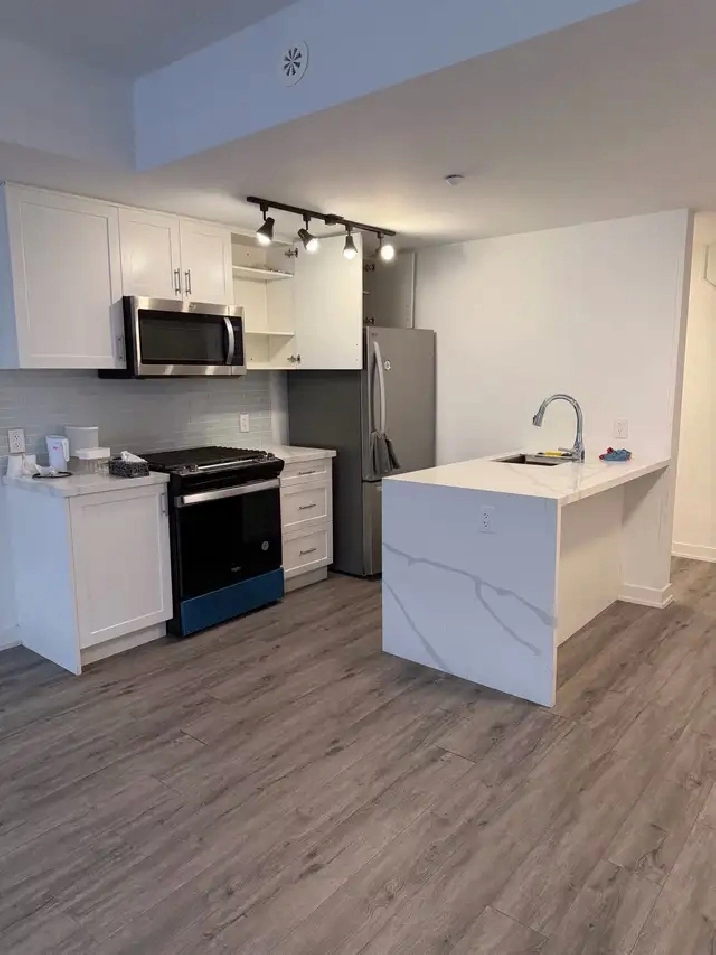 Two bedroom, three bathroom,  parking stacked condo for