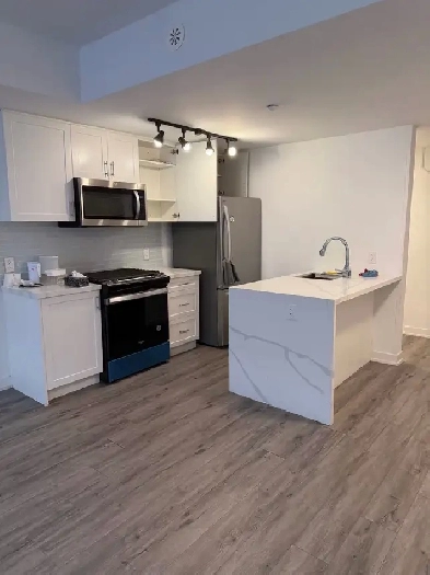 Two bedroom, three bathroom,  parking stacked condo for