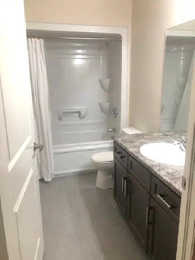 Spacious 3-Bedroom Condo with Balcony, Parking & Ensuite Laundry