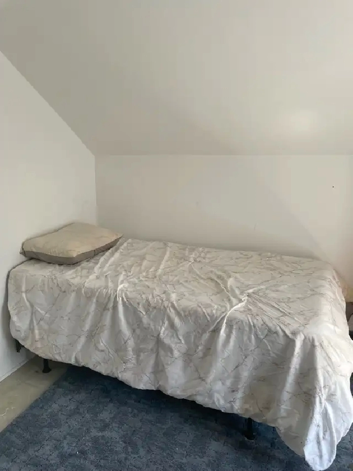 Room for rent with shared accommodations.