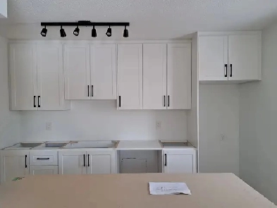 Main floor 2 bdrm   den in quiet sixplex in West end