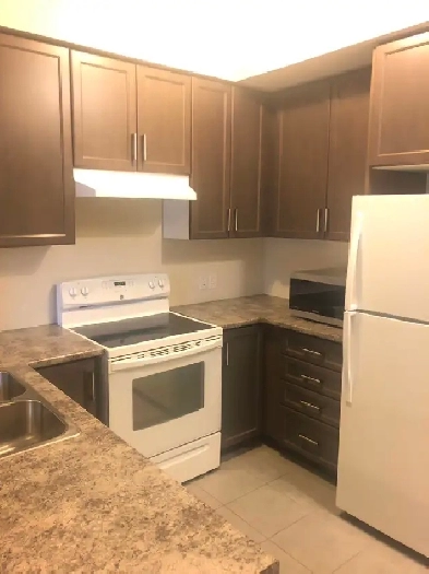 Spacious 3-Bedroom Condo with Balcony, Parking & Ensuite Laundry