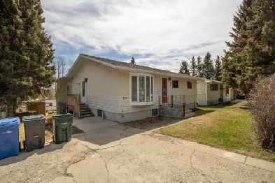 Bungalow for sale with Green space along the Red Deer River