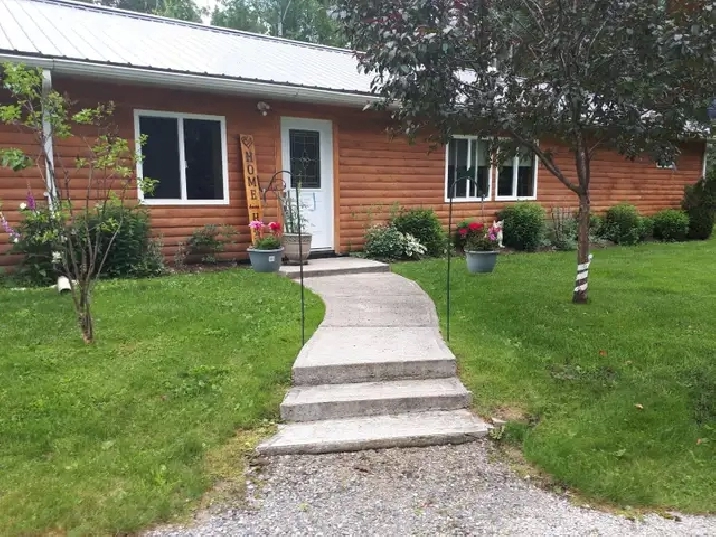 Off Grid home on year round road.