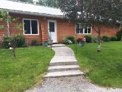 Off Grid home on year round road.