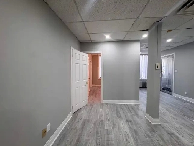 SPACIOUS GROUND-LEVEL COMMERCIAL SUITE WITH LARGE FRONT WIND...