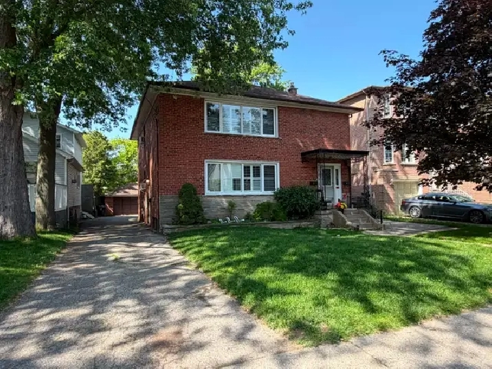 Beautifully renovated detached triplex on a large 50 x 120ft lot
