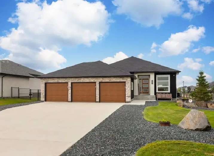 Stunning 4bdrm Bungalow w/Triple Att Garage on a Prime Lake Lot!