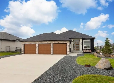 Stunning 4bdrm Bungalow w/Triple Att Garage on a Prime Lake Lot!