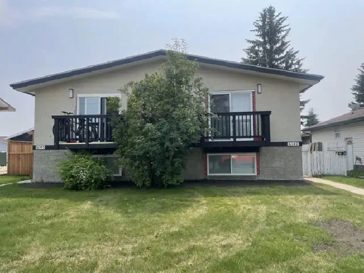 Renovated 3 Bedroom Duplex - Fenced Yard & Two Parking Stall