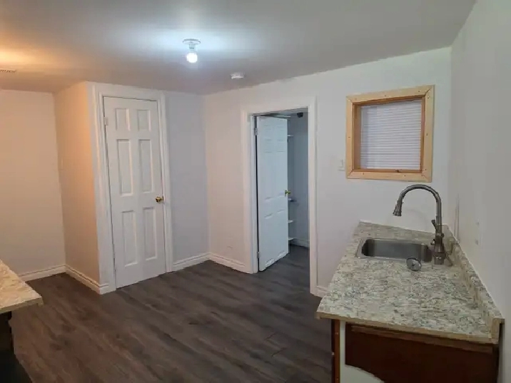 A room  with a privet bathroom  in a walkout basement